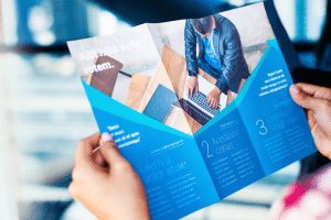 hands holding business brochure 250865 389