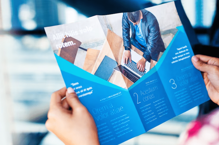 hands holding business brochure 250865 389